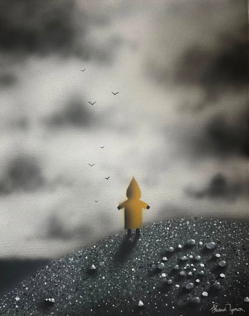 A Shaun Tymon painting of a small boy in a big yellow raincoat standing on a beach on a cloudy day having fun making shapes with stones on the beach. More work available at The Acorn Gallery in Pocklington. Visit us or shop online. 
