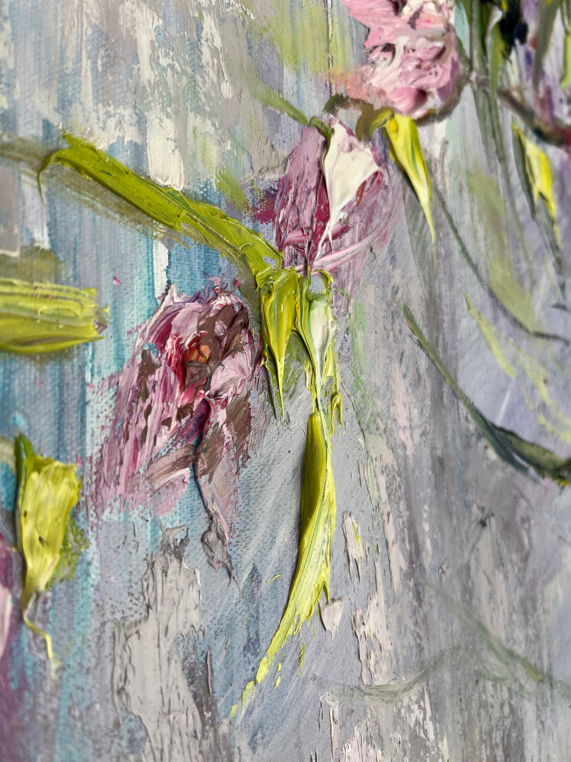 Original textured painting of delicate pink magnolia blossoms against a soft pastel blue and lavender background, created with expressive impasto brushwork by Yulia Lisle. Painting available from The Acorn Gallery in Pocklington. Visit us or Shop online or Call 01759 307652. 