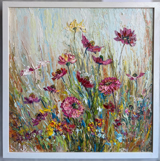 Original textured oil painting of a colourful summer wildflower meadow with pink, purple and yellow blooms, created with expressive impasto palette knife techniques by Yulia Lisle.