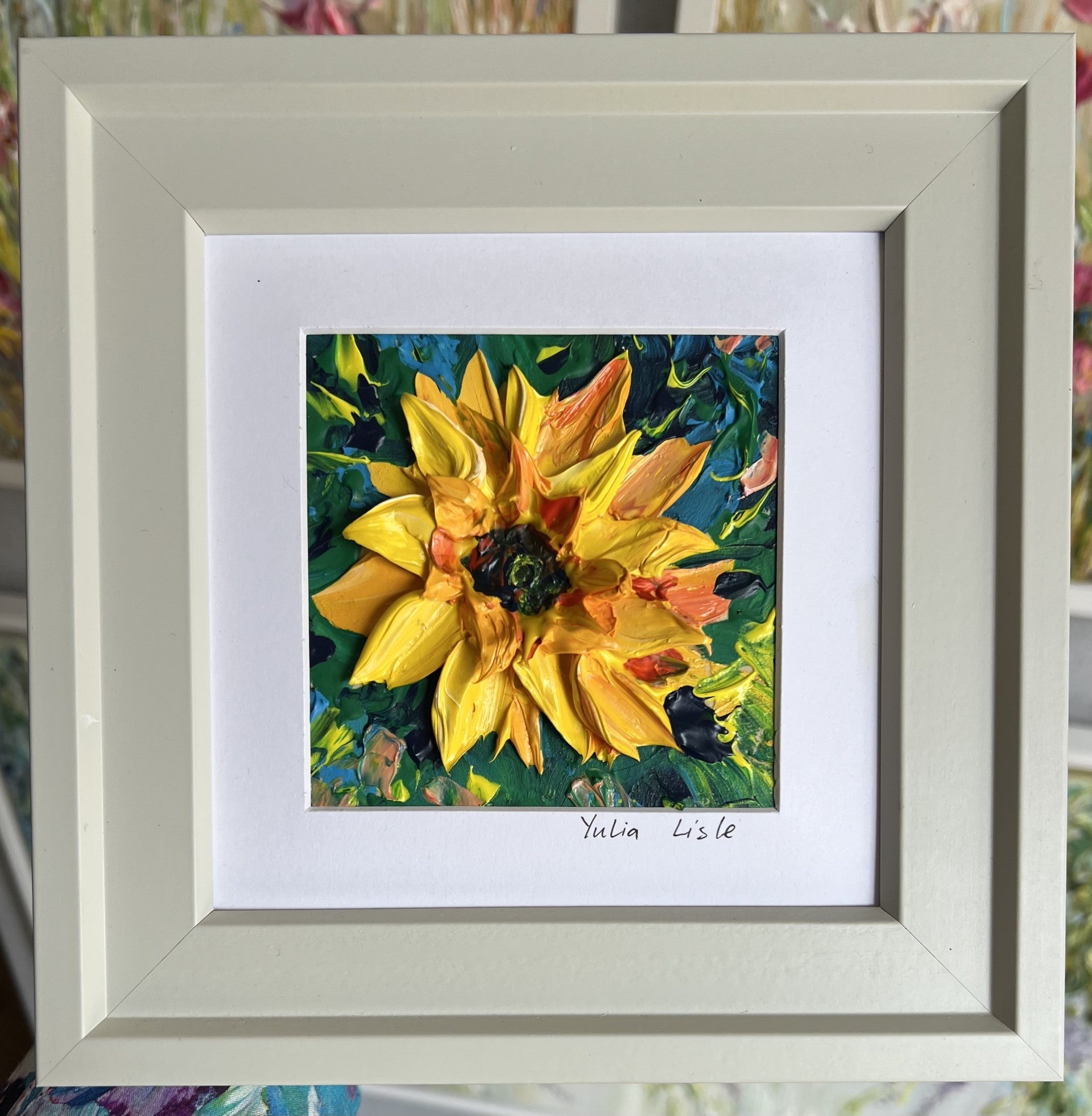 Small freestanding framed original oil painting featuring a richly textured sunflower in vibrant yellow and golden tones, created with expressive impasto paint by Yulia Lisle available at The Acorn Gallery in Pocklington. Shop online or call us on 01759 30652. 