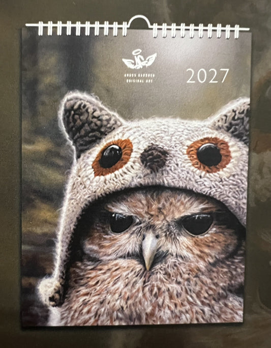 Angus Gardner Calendar for 2027 featuring a detailed owl portrait in a soft grey animal-eared hood cover with spiral binding. 